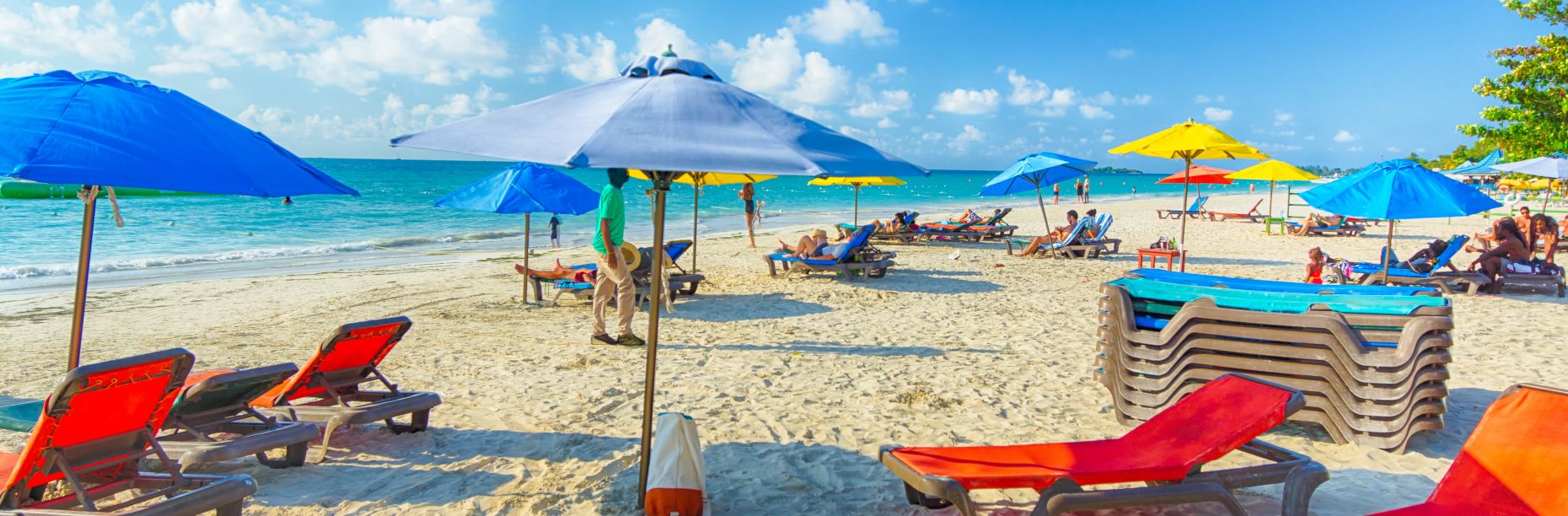 Colorful umbrellas and lounge chairs on the beach