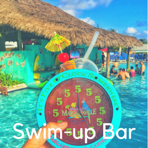 An alarm clock drink holder in front of a swim up bar