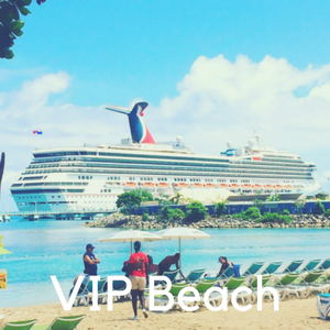 A beach with a cruise ship in the ocean