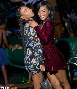 Two women pose for a photo during ladies night at the Margaritaville Caribbean nightclub 